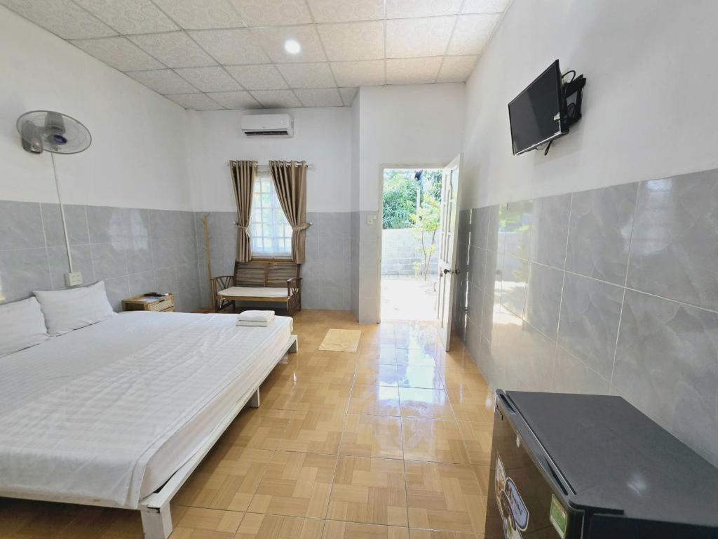 Giường trong phòng chung tại Lac House Mui Ne