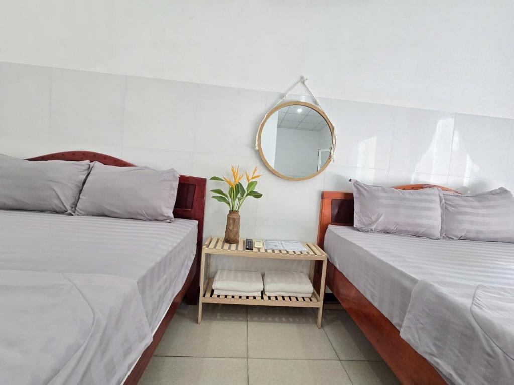 Giường trong phòng chung tại Lac House Mui Ne