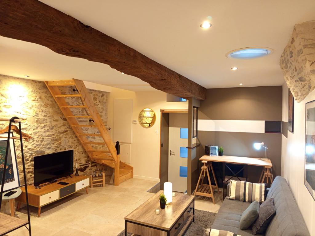 a living room with a loft conversion with a staircase at Escale - Maison - Nantes aéroport in Bouguenais
