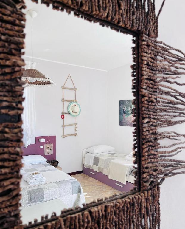 Postel nebo postele na pokoji v ubytování B&B DOÑA FLOR