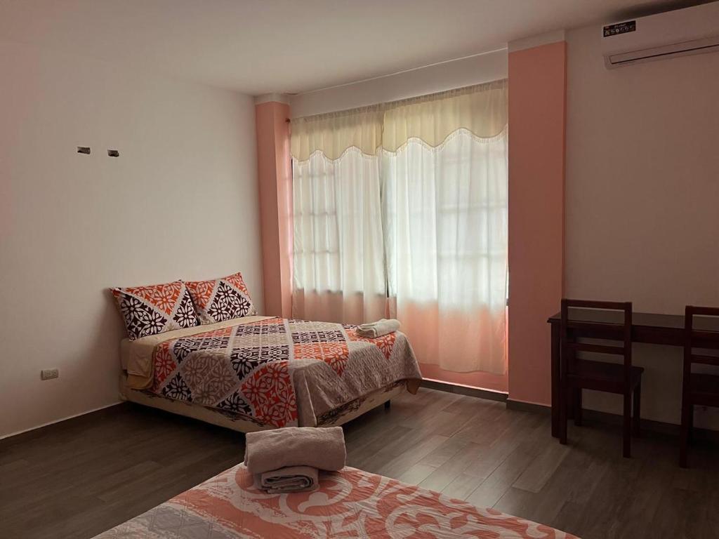 Postel nebo postele na pokoji v ubytování Casa Alexita
