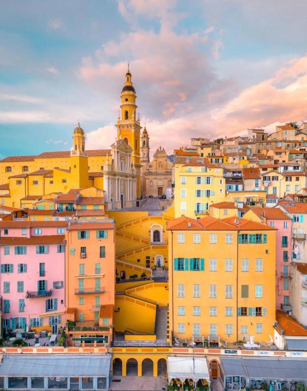 a view of the city of lyon with buildings at Hôtel Gabriel in Menton
