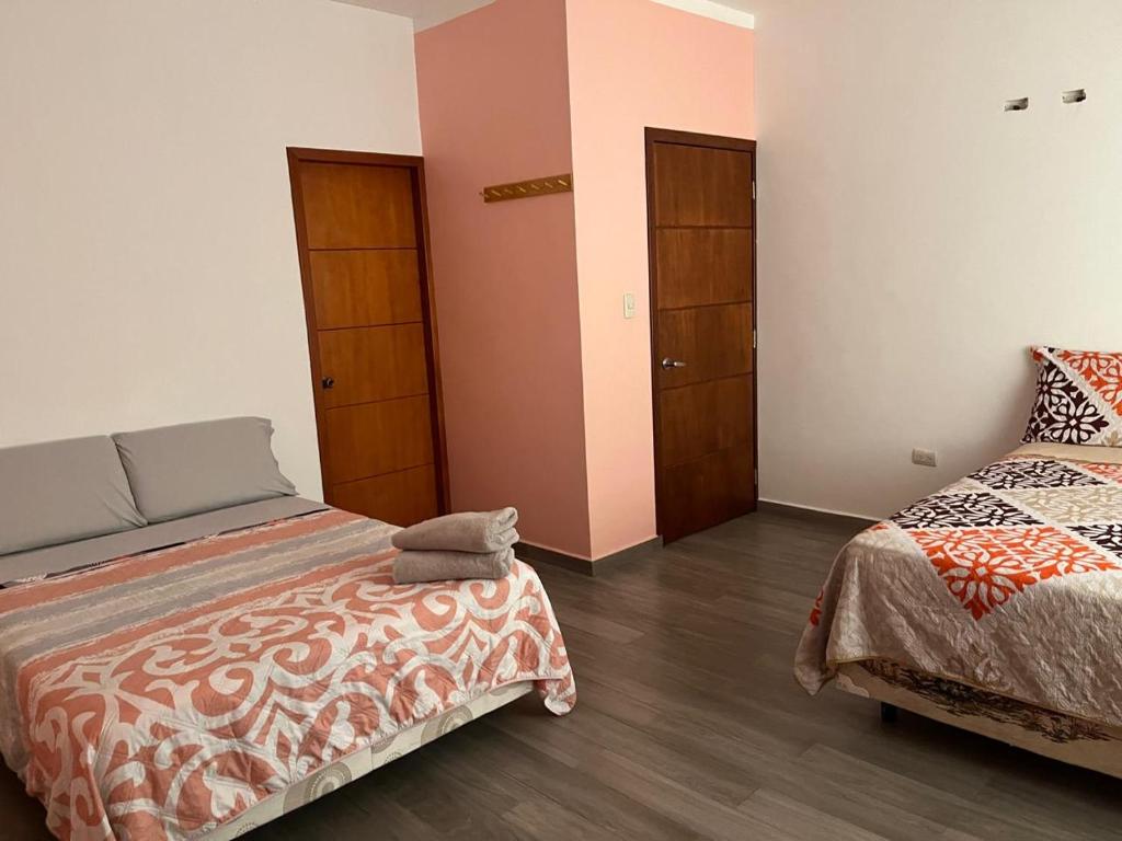 Postel nebo postele na pokoji v ubytování Casa Alexita