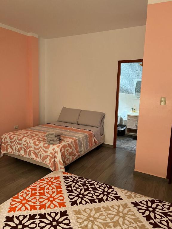 Postel nebo postele na pokoji v ubytování Casa Alexita
