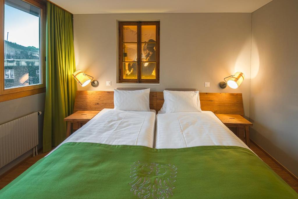 Postel nebo postele na pokoji v ubytování Hotel National