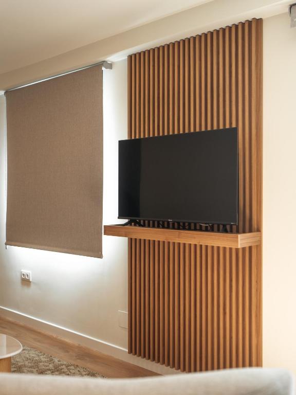 TV a/nebo společenská místnost v ubytování Alisé Apartments Tetuán, by Homing U