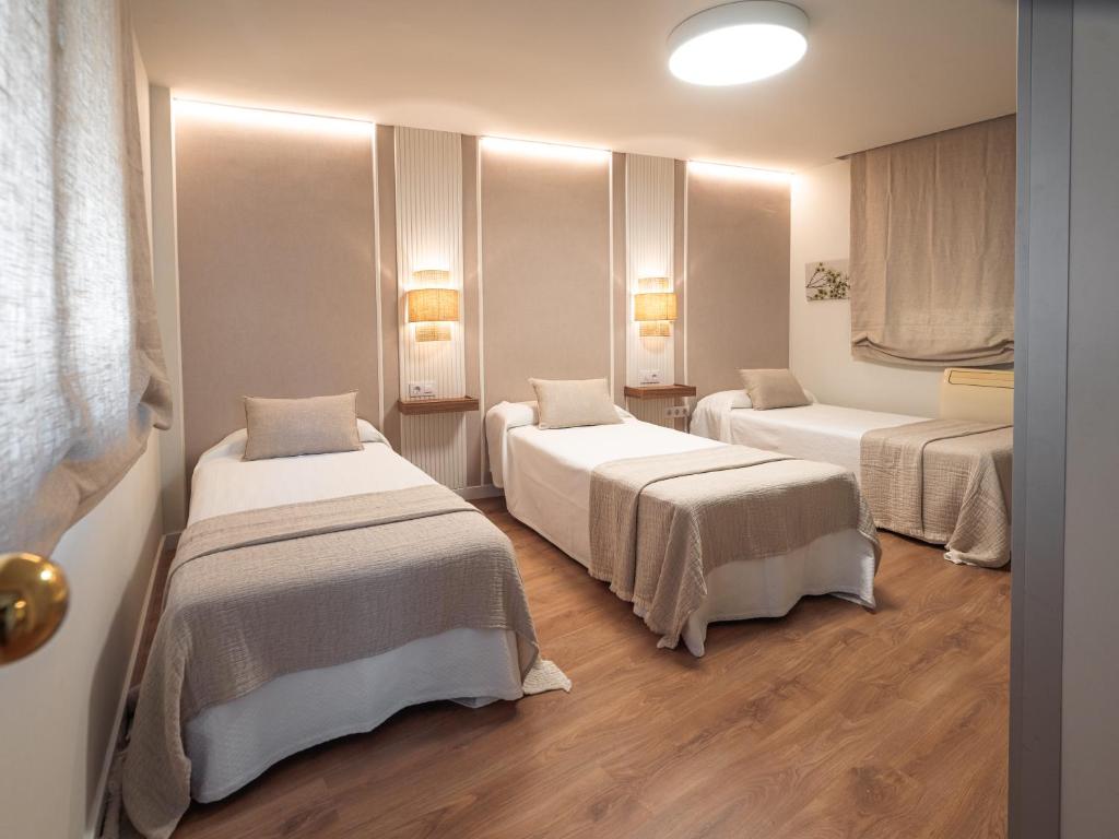 Postel nebo postele na pokoji v ubytování Alisé Apartments Tetuán, by Homing U