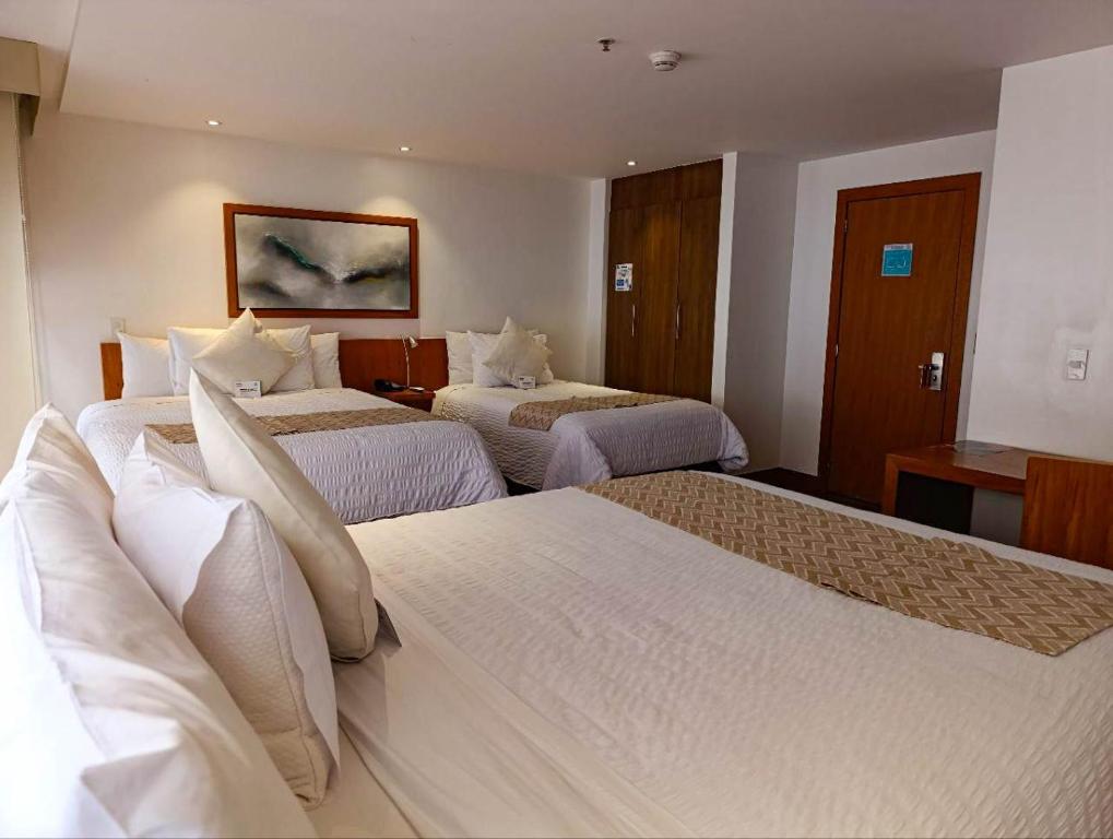 Postel nebo postele na pokoji v ubytování ZEN Hotel