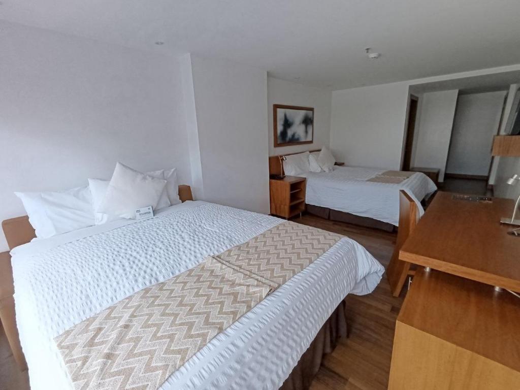 Postel nebo postele na pokoji v ubytování ZEN Hotel