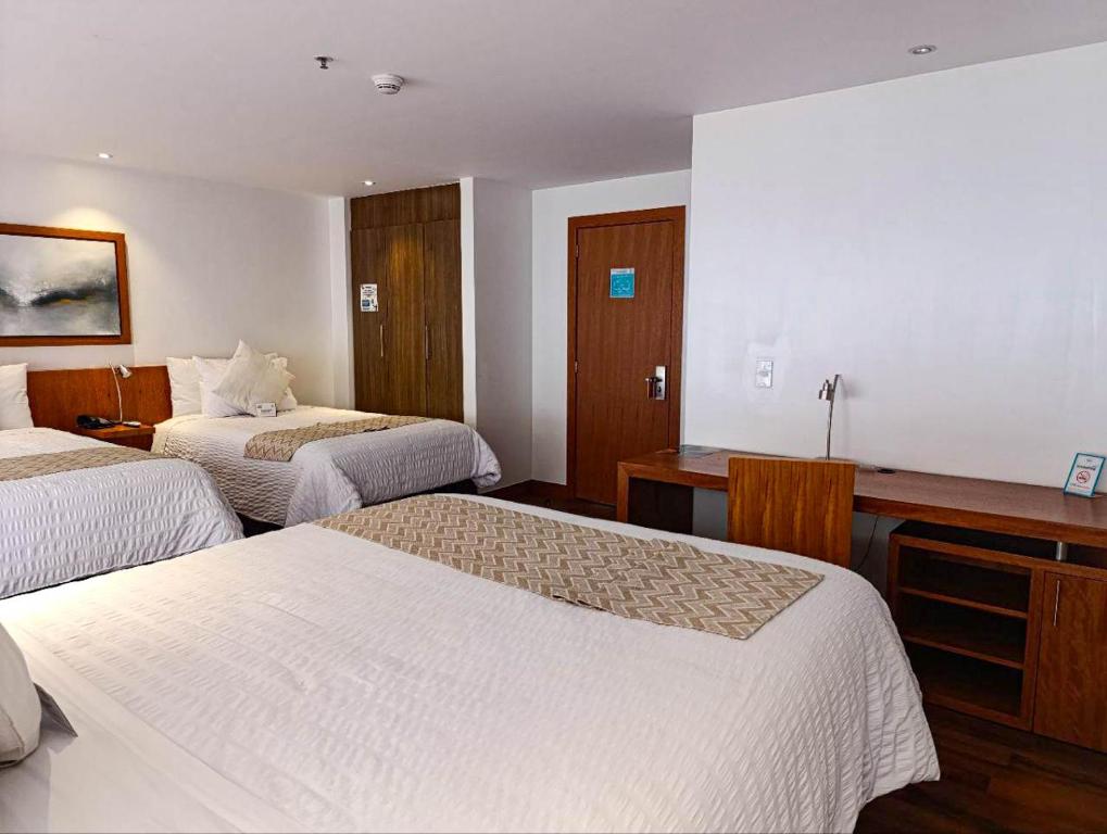 Postel nebo postele na pokoji v ubytování ZEN Hotel