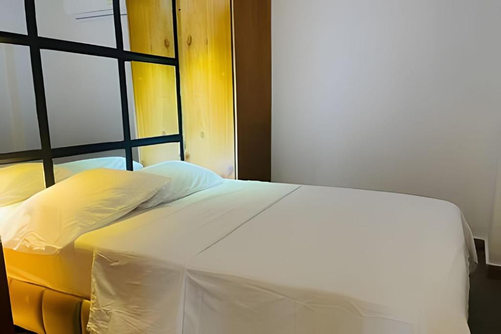 Postel nebo postele na pokoji v ubytování Apartaestudios Calle 76