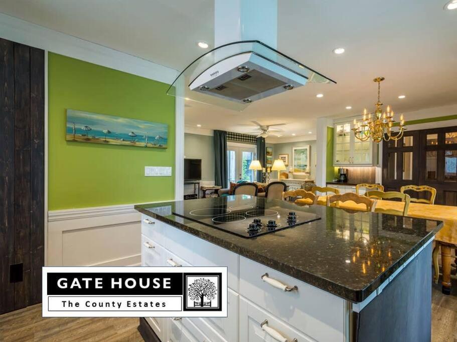a kitchen and living room with a cafe house at Gate House Comfort plus own lake access, dock, 4 mins to beach in West Lake