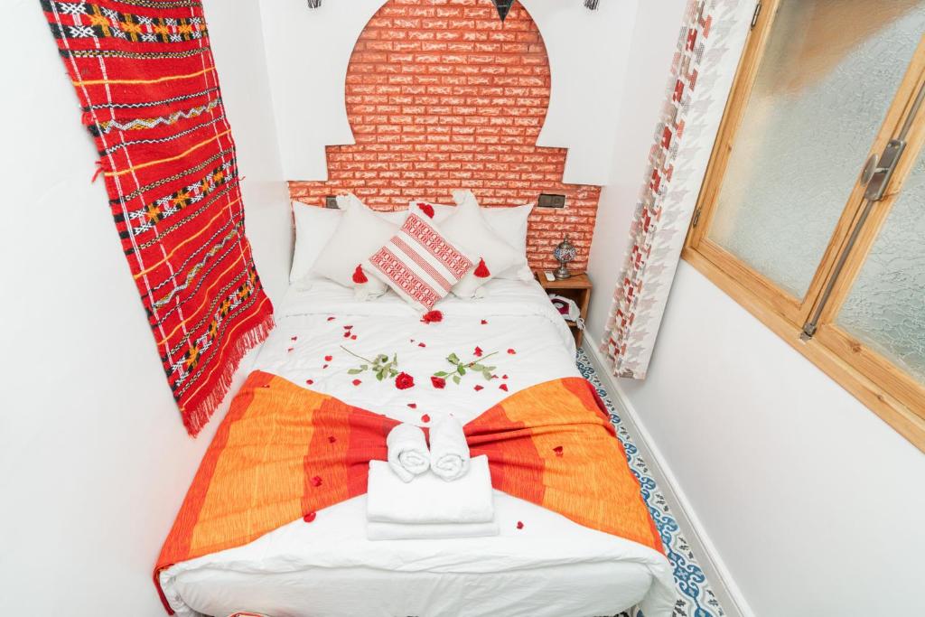 Postel nebo postele na pokoji v ubytování Dar baba Aziz La perle de la Médina