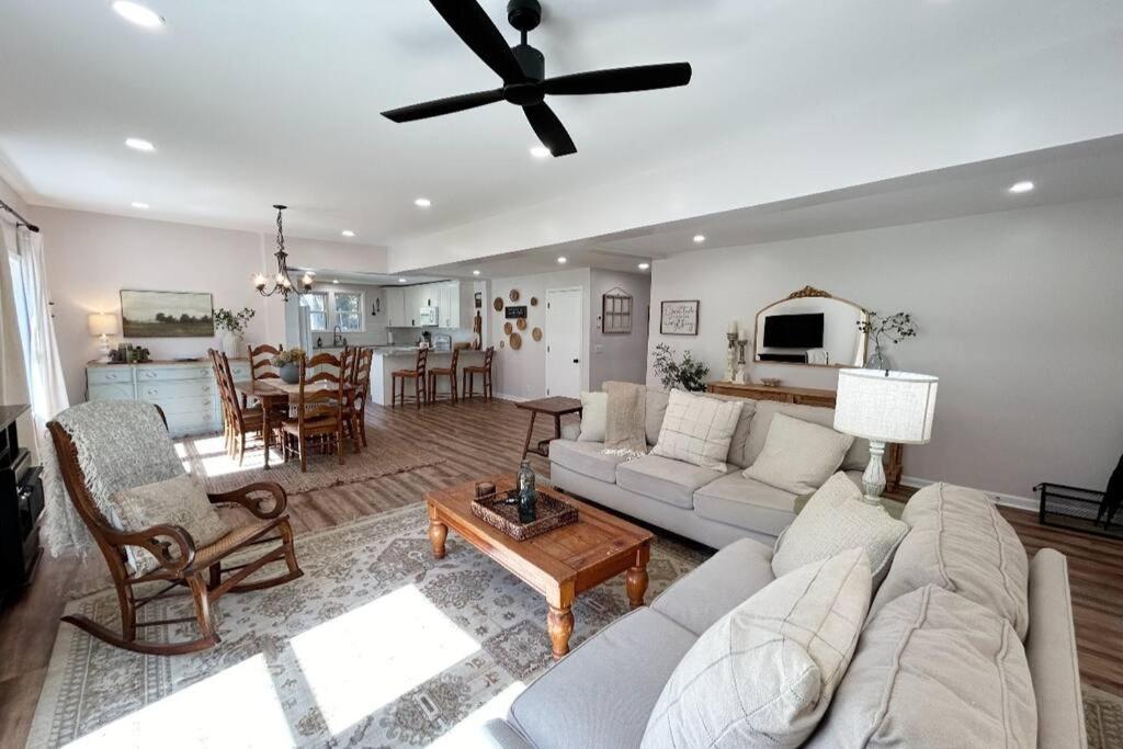a living room with a couch and a table at Norris Lake Modern Farmhouse Retreat in Sharps Chapel
