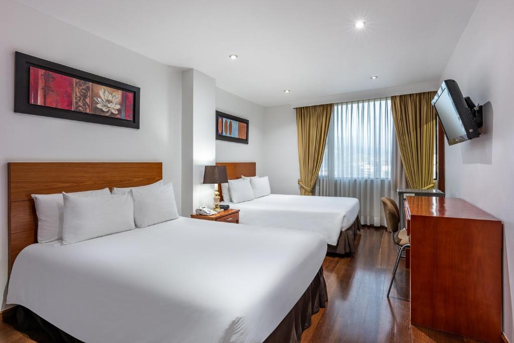 Postel nebo postele na pokoji v ubytování Hotel Andes Plaza