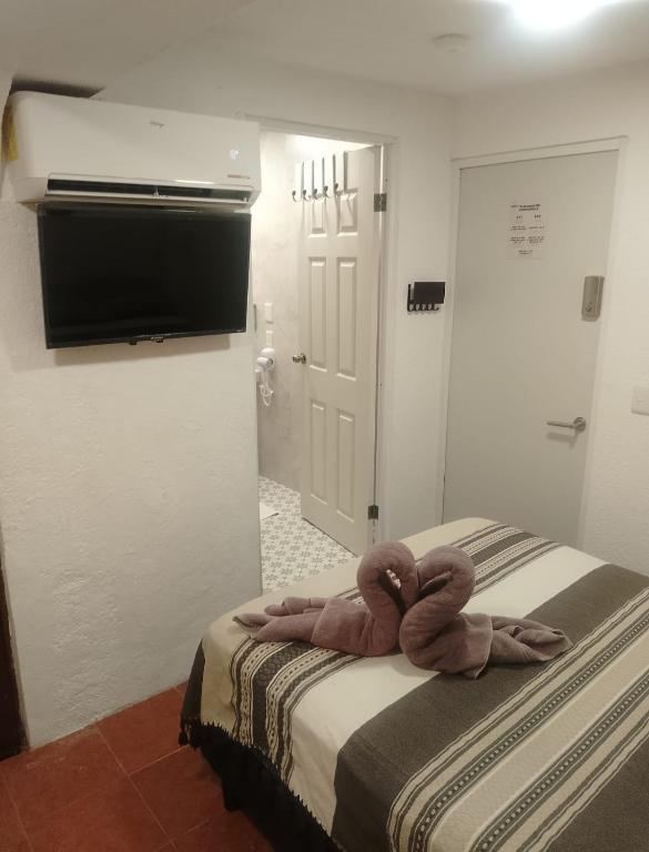 Postel nebo postele na pokoji v ubytování Casa Nance Alojamientos COBA Mercado 28 Smart TV y ADO Centro