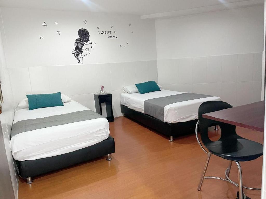Postel nebo postele na pokoji v ubytování Hotel Boutique Radel
