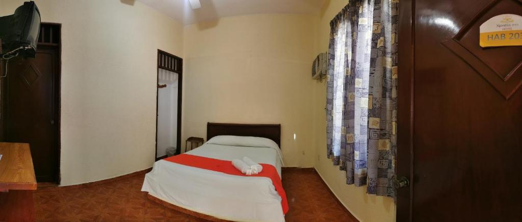 Postel nebo postele na pokoji v ubytování Xpress Inn