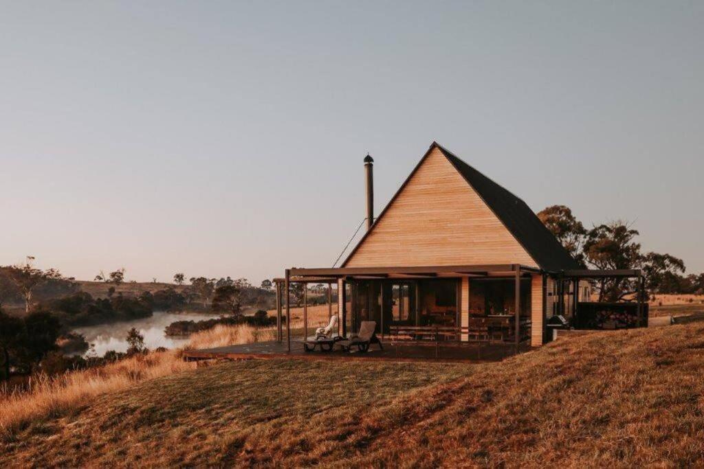 a house on the side of a hill at Swan River Sanctuary in Swansea