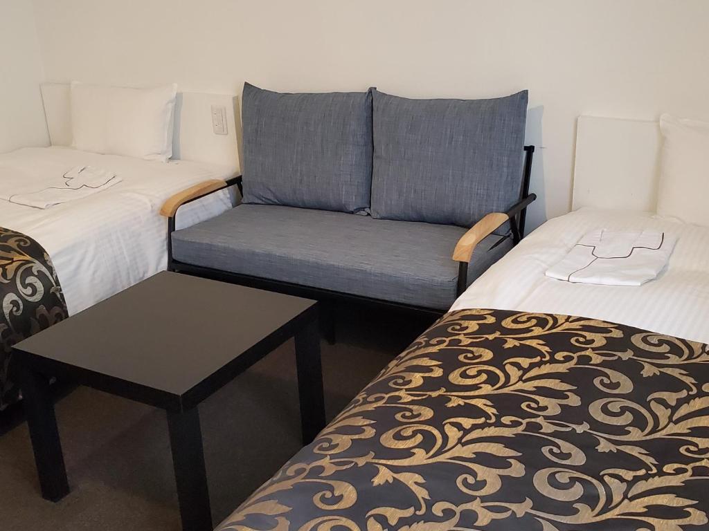 Postel nebo postele na pokoji v ubytování Tachikawa Regent Hotel