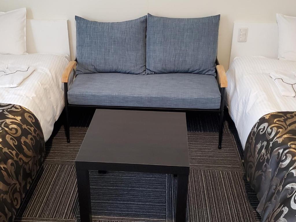 Postel nebo postele na pokoji v ubytování Tachikawa Regent Hotel