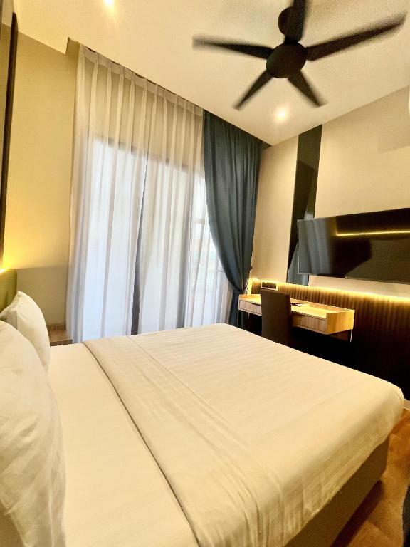 Postel nebo postele na pokoji v ubytování I-VISTA HOTEL