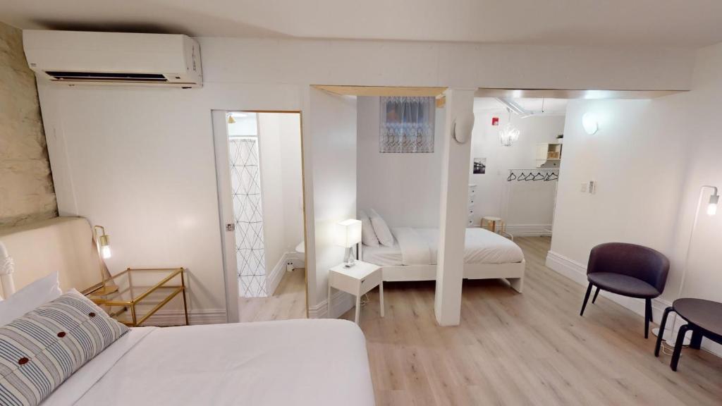 Postel nebo postele na pokoji v ubytování Auberge du Plateau