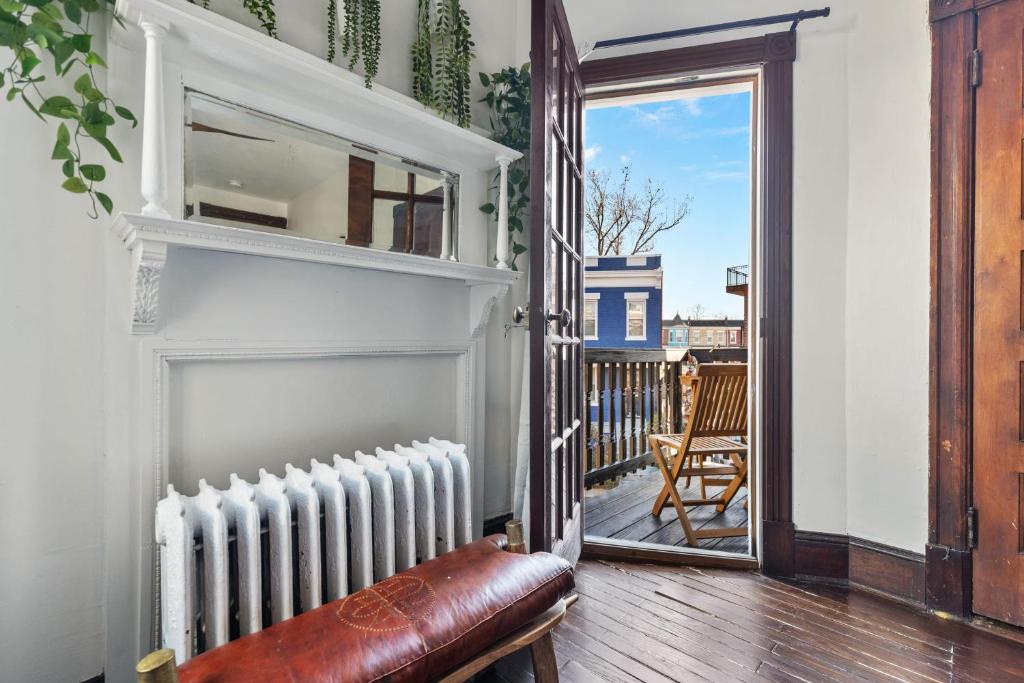 an open door to a balcony with a radiator at 3-BR Historic Home Nestled Btw Petworth & CoHi in Washington, D.C.