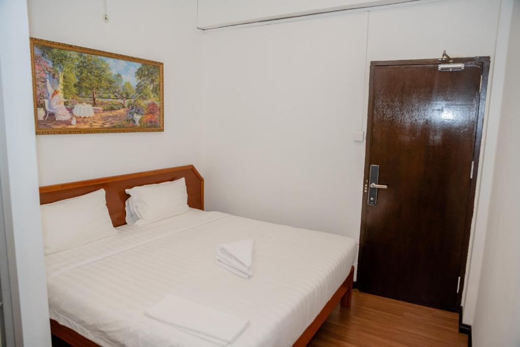 Postel nebo postele na pokoji v ubytování Ong Hotel
