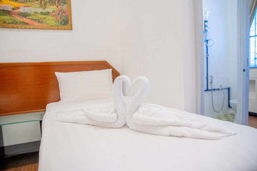 Postel nebo postele na pokoji v ubytování Ong Hotel