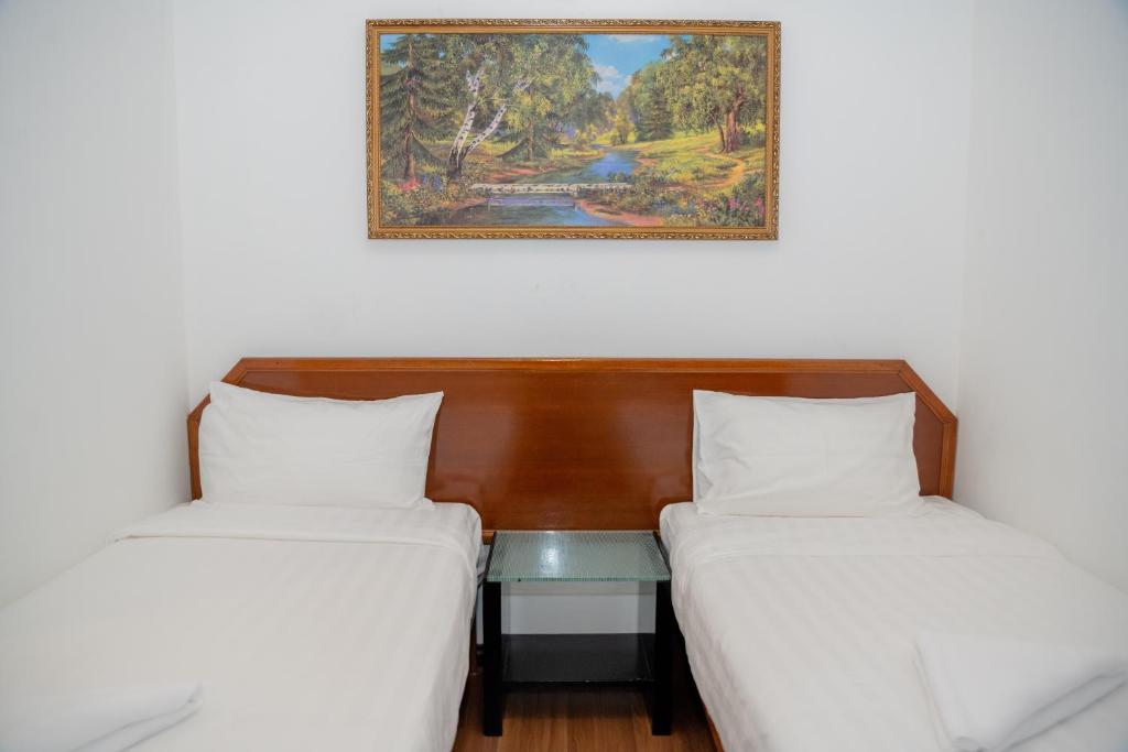 Postel nebo postele na pokoji v ubytování Ong Hotel