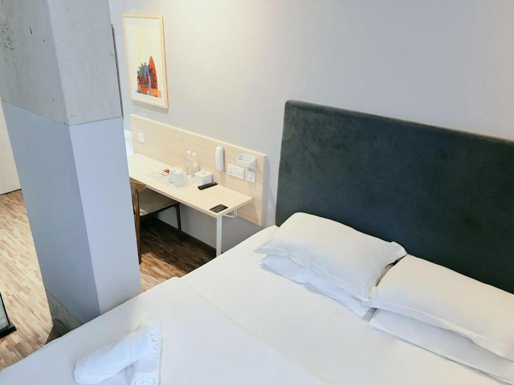 Postel nebo postele na pokoji v ubytování Hako Hotel
