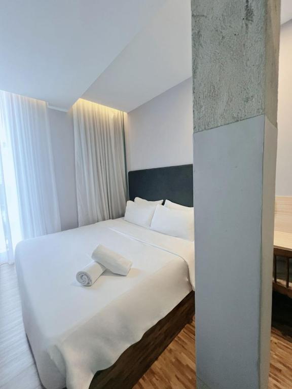 Postel nebo postele na pokoji v ubytování Hako Hotel