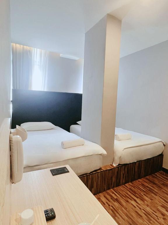 Postel nebo postele na pokoji v ubytování Hako Hotel