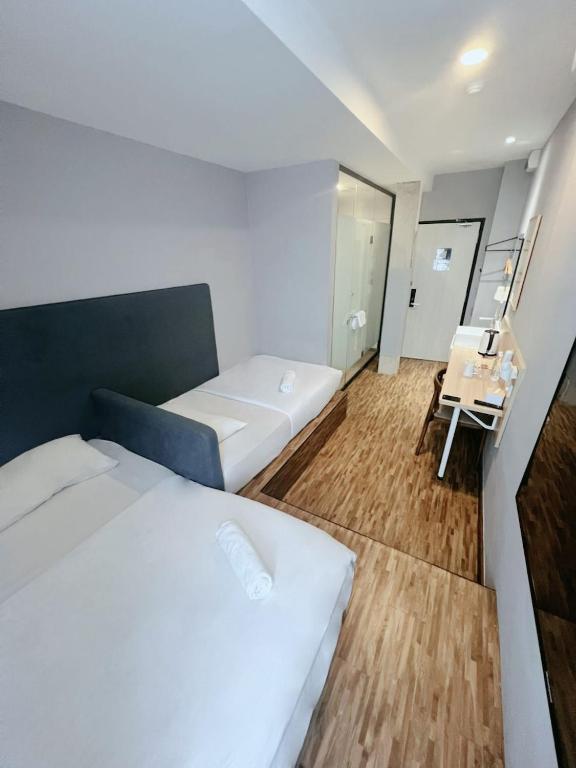Postel nebo postele na pokoji v ubytování Hako Hotel