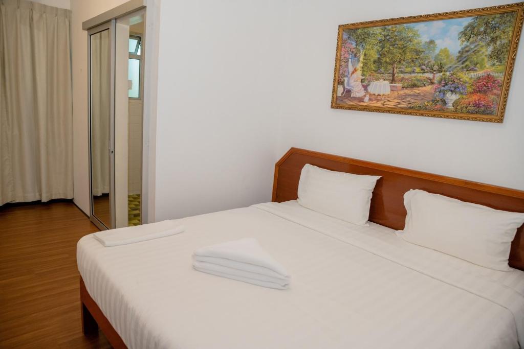 Postel nebo postele na pokoji v ubytování Ong Hotel