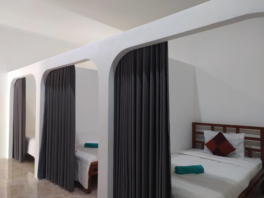 Voodi või voodid majutusasutuse Wanderlust Hostel Mandalika toas