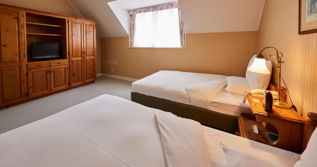 Postel nebo postele na pokoji v ubytování Forest Villa Huis Ten Bosch