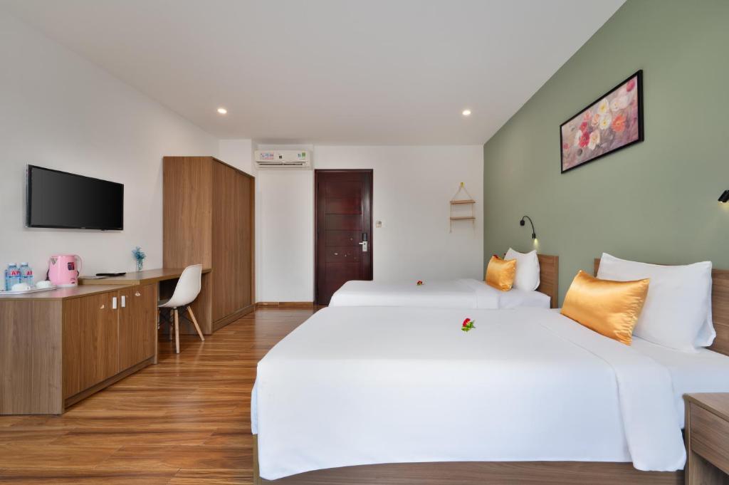 Postel nebo postele na pokoji v ubytování Hoi An January Villa