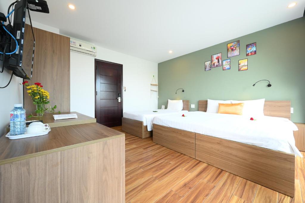 Postel nebo postele na pokoji v ubytování Hoi An January Villa