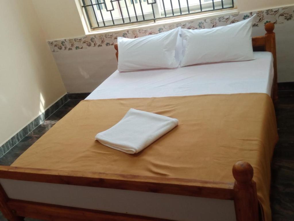 Postel nebo postele na pokoji v ubytování LJ Rooms