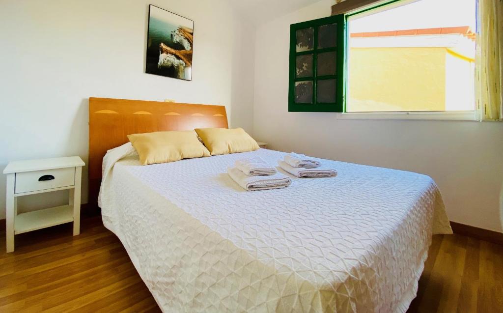 Postel nebo postele na pokoji v ubytování Cozy and Sunny Bungalow in Maspalomas