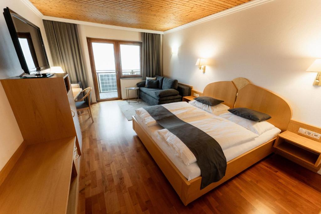 Postel nebo postele na pokoji v ubytování Aparthotel Pfeffermühle