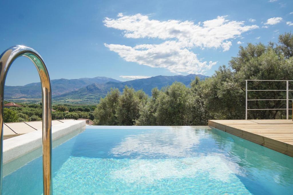 a swimming pool with a view of the mountains at Villa Gianna Maria in Paleros