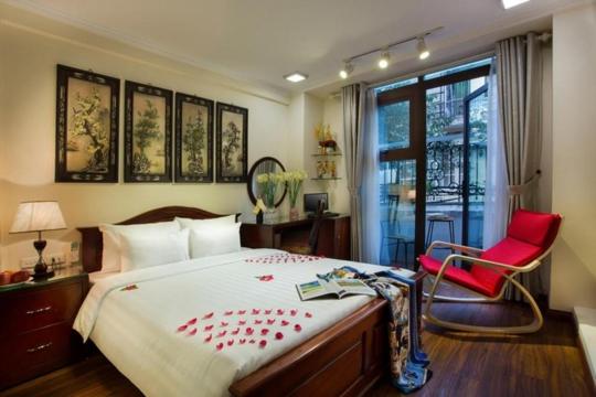 Postel nebo postele na pokoji v ubytování Viet Hotel & Travel