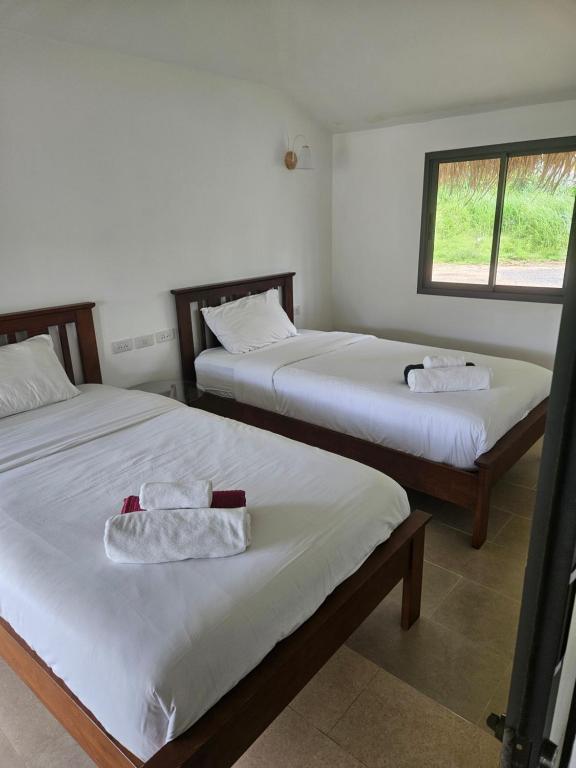 Postel nebo postele na pokoji v ubytování Sunrise Beach Resort