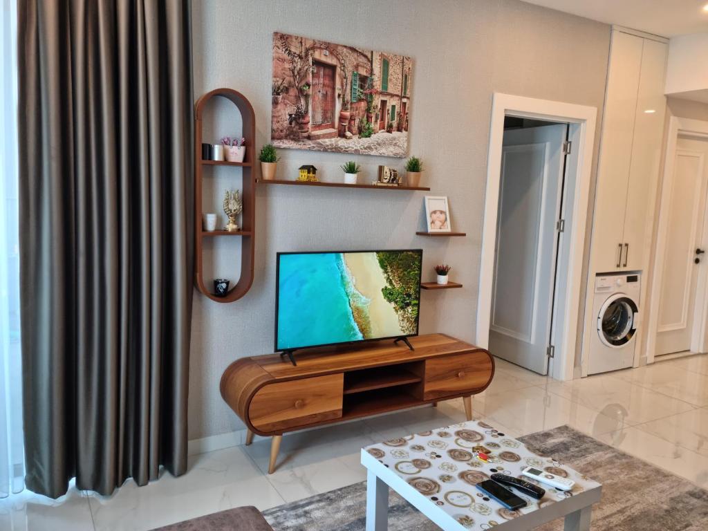 TV a/nebo společenská místnost v ubytování Apartment Cleopatra beach