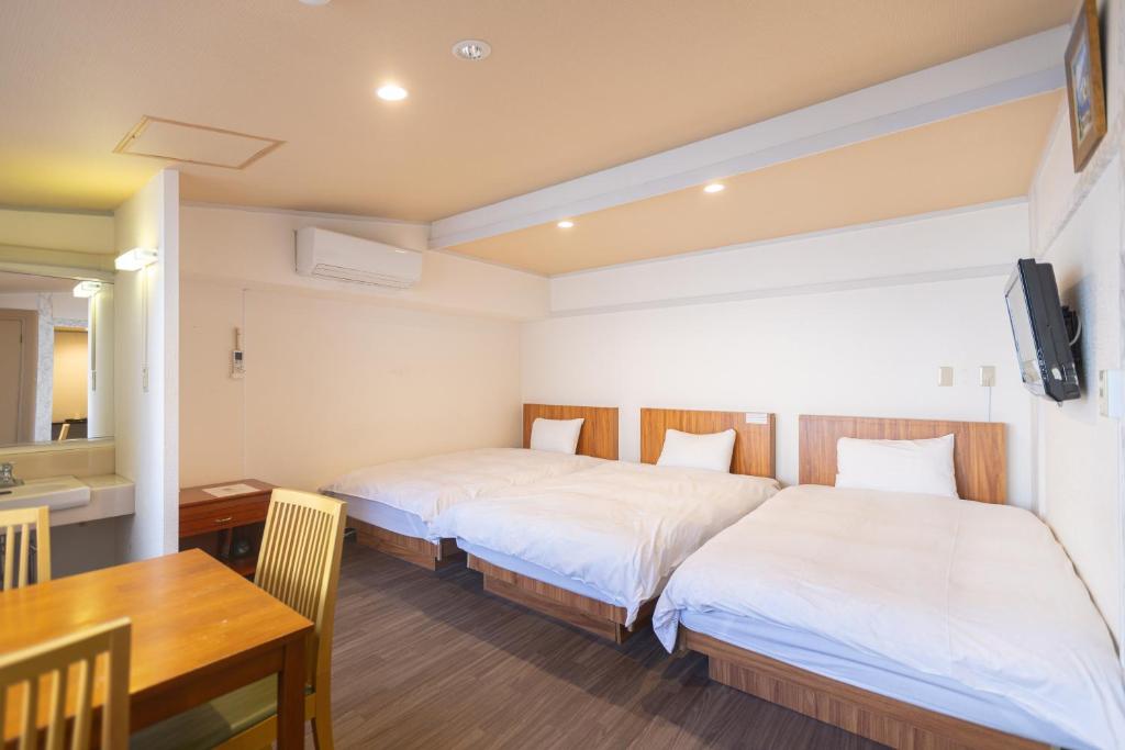 Postel nebo postele na pokoji v ubytování Miro Hotel Dotonbori