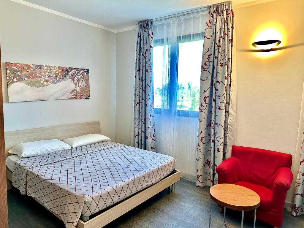 Postel nebo postele na pokoji v ubytování Hotel Del Parco