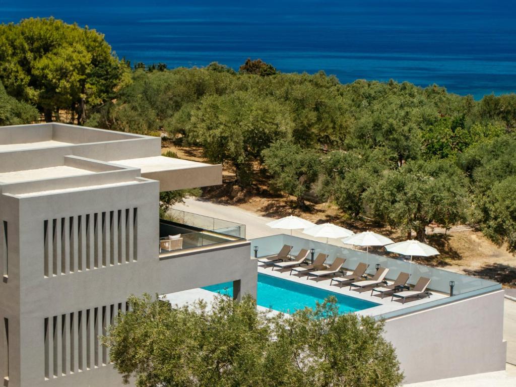 an aerial view of a resort with a swimming pool and the ocean at Villa Frantzeska - Elegant Villa close to Tsilivi, by ZanteWize in Tsilivi